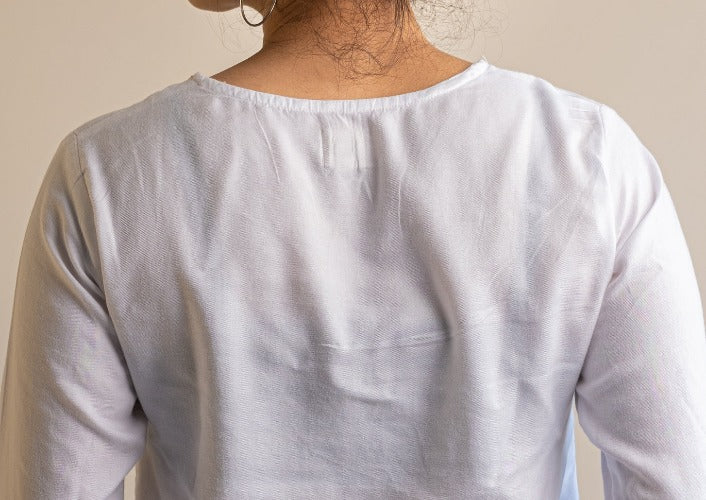 White Embroidered Peplum Top in Lyocell fabric by Earthy Route, a sustainable clothing brand. The fabric is breatheable and summer friendly. This product has freeshipping.